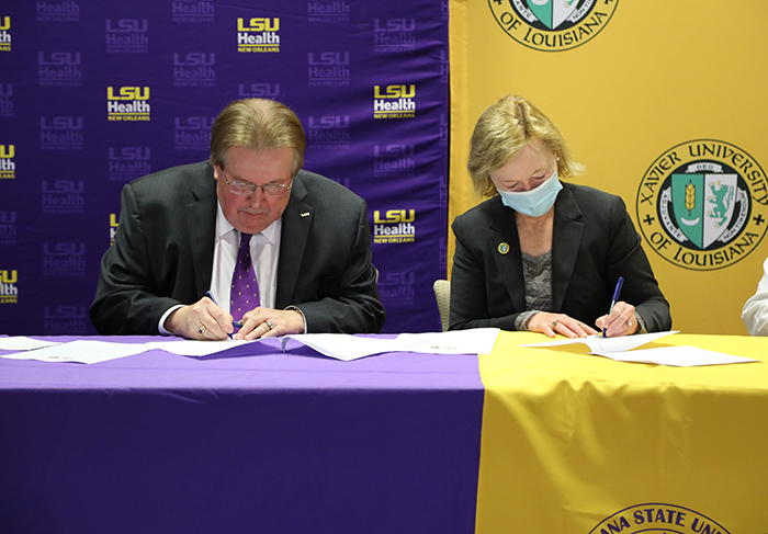 Dr. Steve Nelson and Dr. Anne McCall signing MOU